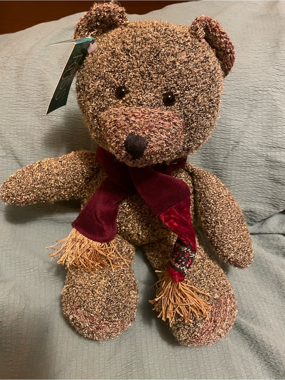 This is a 1990s Russ Berrie Shimmers metallic knit plush teddy bear.